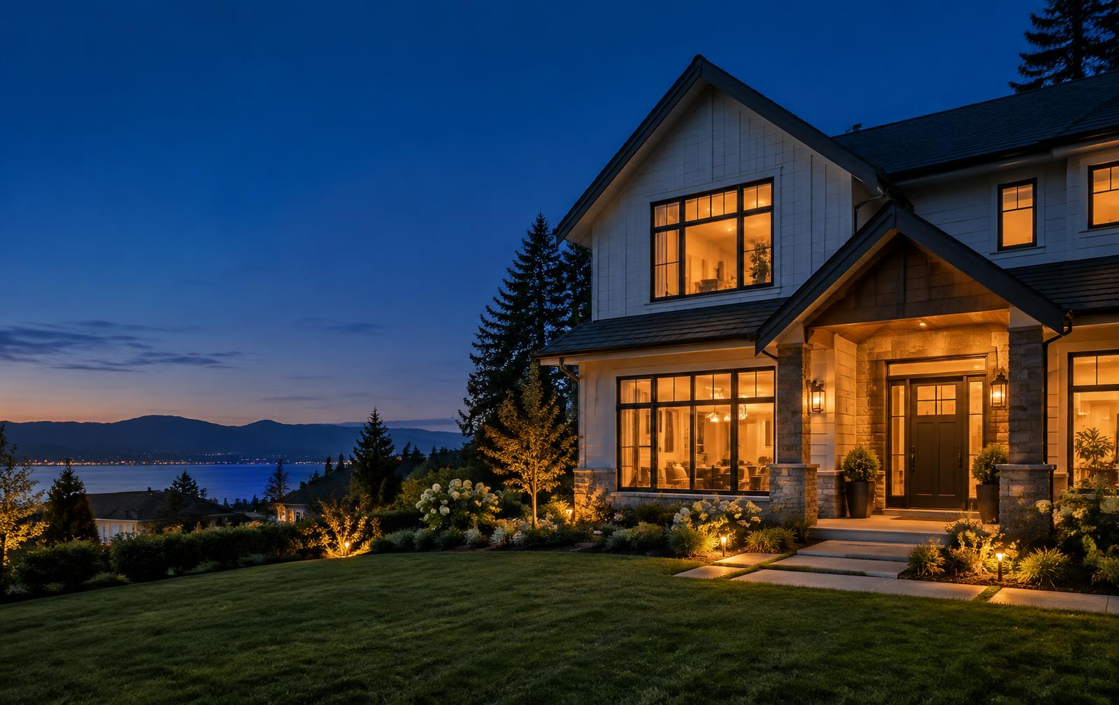 A family home glowing with warm light at dusk
